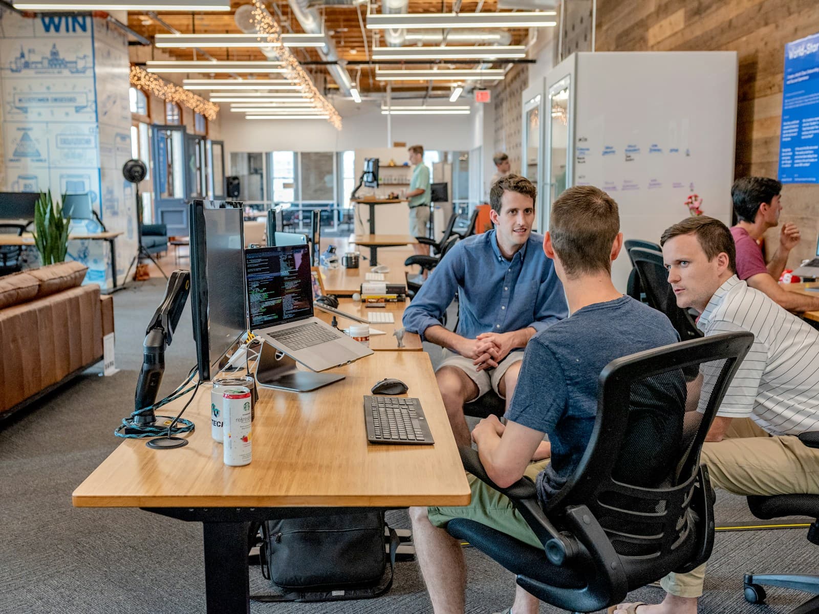 Engineering team discussing work in an office